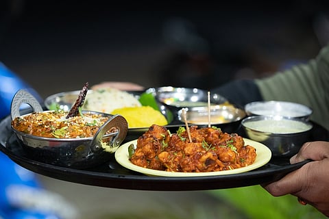 A plate of food with meat in it