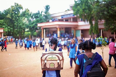 Girl students making their way into a school in karnataka an Indian state