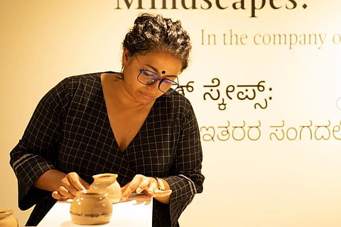 Artist Indu Antony installing her work at MAP