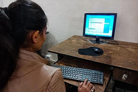 women working at a computer
