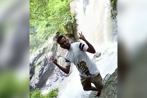 Ajay posing from the rocks before he fell