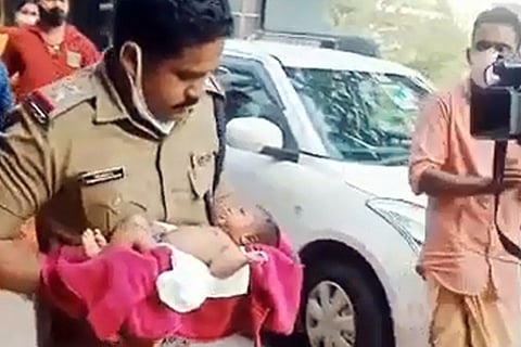 Kottayam baby abduction: Police officer carrying the kidnapped baby