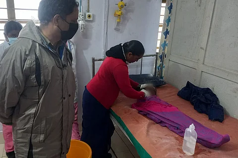 Doctors attend to four-year-old Saridha who was attacked by a leopard