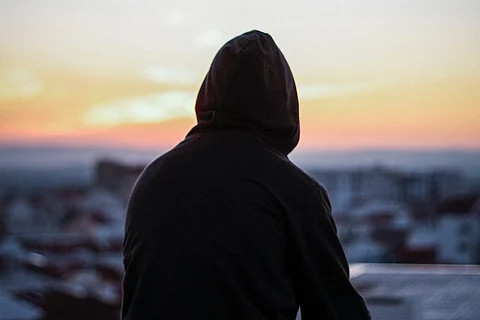 A man sitting on a roof