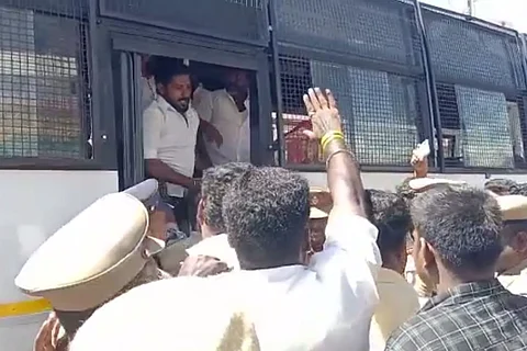 Protestors being detained by the police in Theni