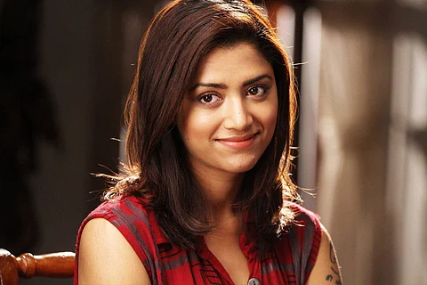 Actor Mamta Mohandas in a deep pink top
