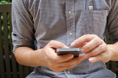 Representative image of a man on phone