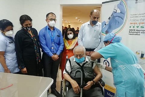 97 year old man getting vaccinated in Manipal Hospital in Bengaluru