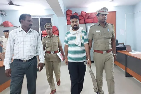 Manish Kashyap being escorted by the police