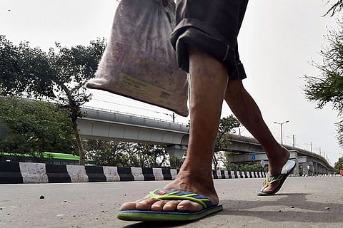 With transport shut for COVID-19 lockdown, Indian migrant workers begin walking home