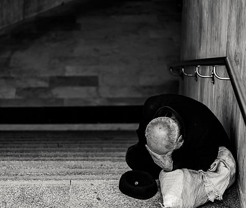 Representative image of a man sitting on a staircase