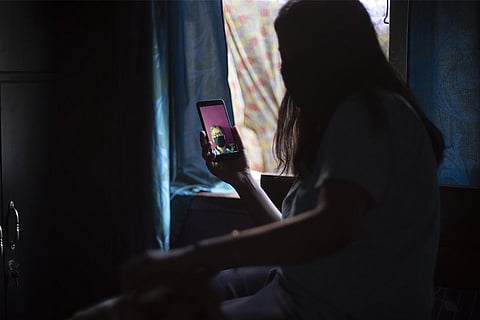 A woman talks to her father in video call during lockdown.