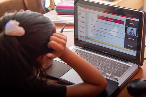 Student sitting for online class