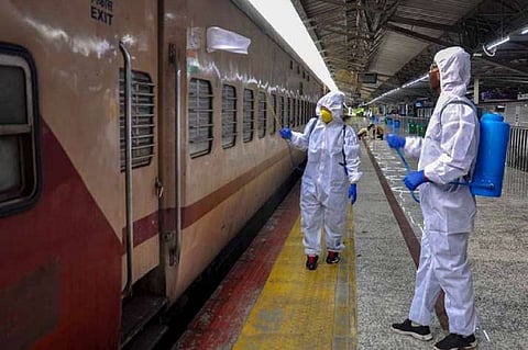 Trains are being sanitised by the sanitisation staff at a railway station