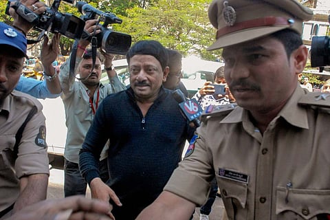 Ram Gopal Varma being escorted by police in Hyderabad in 2018: He has now been booked in a Rs 56 lakh cheating case