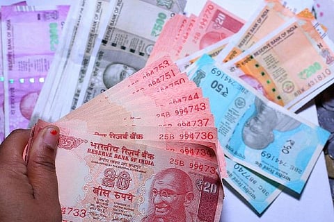 Piles of Indian currency notes laid over each other