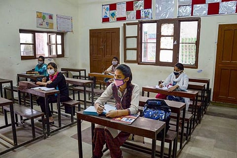 Representative image of students writing an exam