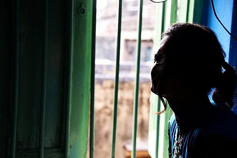 A woman staring out of a window