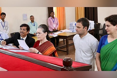 No, this isn’t Justice Murlidhar with Sonia Gandhi when she filed nomination papers