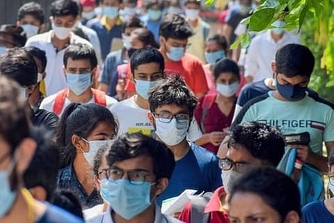 Students wearing mask walking out