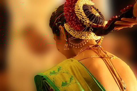 A young woman dressed like a bride