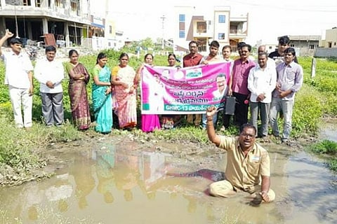 Hyderabad corporator declares war against overflowing sewage, sitting inside sump