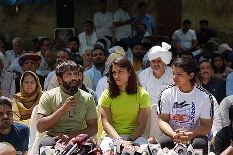 Vinesh Phogat flanked by Sakshi Malik and Bajrang Punia