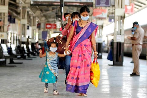 A woman walking with a child