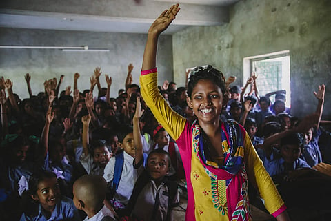 Woman leader of Bandhan Mukti, a survivors’ collective, posing after a school sensitisation workshop