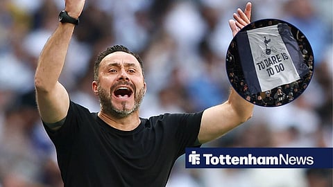 Roberto De Zerbi flailing his arms from the touchline at the Tottenham Hotspur Stadium, looking in the direction of Tottenham fans holding the flag 'To Dare Is To Do'.