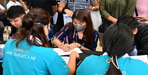 (FILES) A job applicant completes the necessary forms for employment at SM City Grand Central in 2023