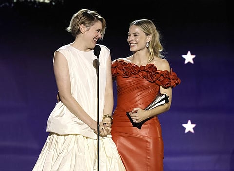 Greta Gerwig and Margot Robbie accept the Best Comedy Award for "Barbie" onstage during the 29th Annual Critics Choice Awards at Barker Hangar on January 14, 2024 in Santa Monica, California.