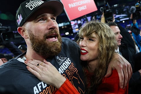 Travis Kelce of the Kansas City Chiefs (L) celebrates with Taylor Swift after defeating the Baltimore Ravens in the AFC Championship Game at M&T Bank Stadium on 28 January in Baltimore, Maryland.