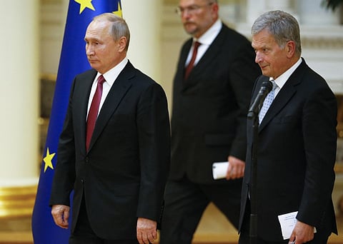 (FILES) President of the Republic of Finland Sauli Niinisto (R) and his Russian counterpart Vladimir Putin walk to attend a press conference after their meeting at the President’s official residence Mantyniemi in Helsinki, Finland, on 21 August 2019. Finland goes to the polls on 28 January 2024 to elect a new president, whose role leading foreign policy has been amplified by heightened tensions with neighboring Russia following the war in Ukraine.
