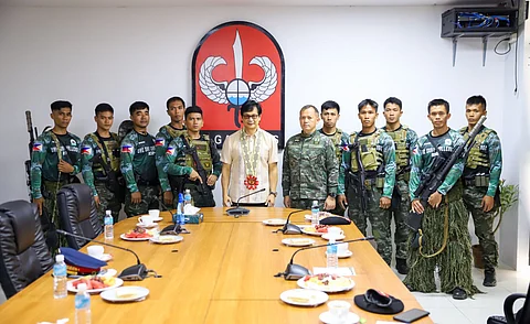 Department of Interior and Local Government Secretary Benhur Abalos with the 84th Special Action Company-Rapid Deployment Battalion of the Philippine National Police.