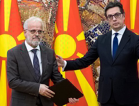 President of North Macedonia Stevo Pendarovski (R) gives the mandate to former speaker of parliament Talat Dzaferi (L) to form and lead a technical government until the upcoming presidential and parliamentary elections, in Skopje, on 26 January 2024.