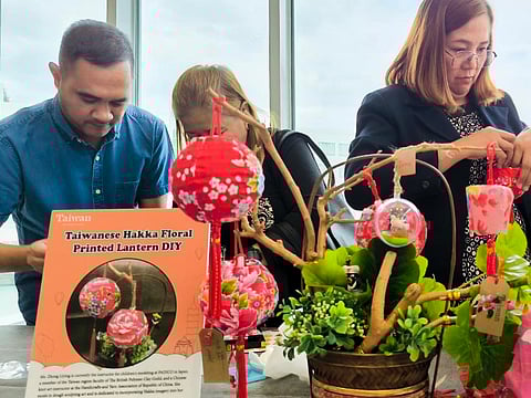 Participants of the Taiwan Tourism Workshop show off their crafting skills in making mini lanterns at the SMX Convention Center Clark on 31 January 2024.
