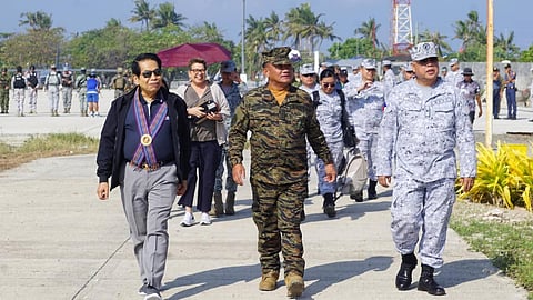 Philippine Navy Flag Officer in Command Vice Admiral Toribio Adaci Jr. (center), accompanied by Navforwest Commander Commodore Alan Javier (right) and a representative from a multi-sectoral group visit Pag-asa Island in Kalayaan town in the West Philippine Sea on 23 February 2024. (Photo from Philippine Navy)