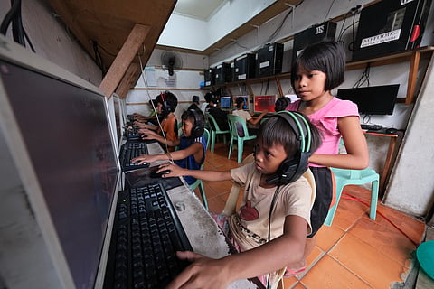 FILE: Children in an internet cafe in Cagayan de Oro City on 24 July 2023.