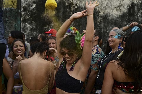 Revelers take part in the "Ceu a Terra" street carnival "bloco" group parade at the Santa Teresa neighborhood in Rio de Janeiro, Brazil on 4 February 2024. Hundreds of traditional 'blocos' will parade in the run-up to Brazil's annual world-renowned Carnival.