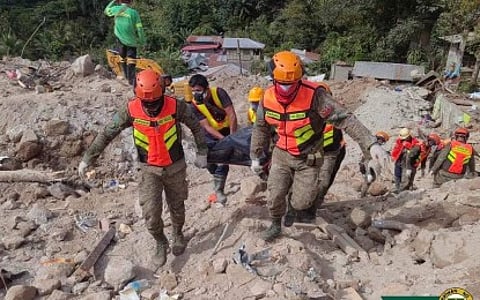 (FILES) AFTERMATH. Philippine Army soldiers retrieve a cadaver during search and rescue operations in landslide-hit Barangay Masara, Maco, Davao de Oro on 10 February 2024. The NDRRMC on Tuesday (20 February) said infrastructure damage from the effects of bad weather in various parts of Mindanao exceeded P1 billion.