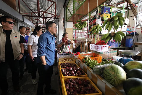 Senator Christopher ‘Bong’ Go visits a public market in Morong, Rizal province on Thursday to check on the newly constructed vegetable and fruit section that his office funded.