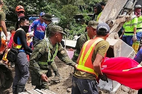 In this handout photo from the Eastern Mindanao Command, Armed Forces of the Philippines (AFP), taken on 7 February 2024 and received on 8 February 2024, shows responders conducting search and rescue operations in Maco, Davao de Oro.