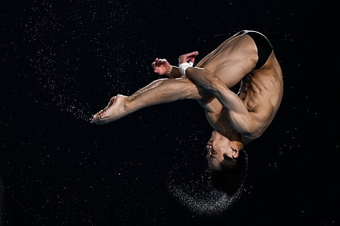China's Yang Hao competes in the final of the men's 10m platform diving event during the 2024 World Aquatics Championships at Hamad Aquatics Centre in Doha on 10 February 2024.