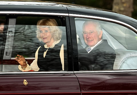Britain's King Charles III and Britain's Queen Camilla wave as they leave by car from Clarence House in London on February 6, 2024.