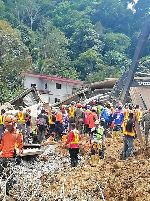 In this handout photo from the Eastern Mindanao Command, Armed Forces of the Philippines (AFP) taken on February 7, 2024 and received on February 8, 2024, shows responders conduct search and rescue operations in Maco, Davao de Oro.