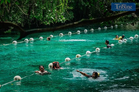 Tourists take a dip in the clean turquoise blue waters of Enchanted River in Hinatuan, Surigao del Sur on Saturday, February 17, 2024. Photo by Yummie Dingding