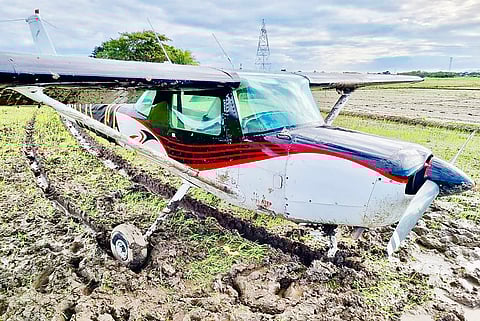 Photograph courtesy of CAAP
THE Cessna C152-type aircraft rests on a rice field in Malolos, Bulacan yesterday after its pilot, along with a flight training student, lands it safely after developing mechanical problems.