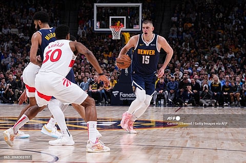 Nikola Jokic #15 of the Denver Nuggets handles the ball during the game against the Toronto Raptors on March 11, 2024 at the Ball Arena in Denver, Colorado. NOTE TO USER: User expressly acknowledges and agrees that, by downloading and/or using this Photograph, user is consenting to the terms and conditions of the Getty Images License Agreement. Mandatory Copyright Notice: Copyright 2024 NBAE Garrett Ellwood/NBAE via Getty Images/AFP
Garrett Ellwood / NBAE / Getty Images / Getty Images via AFP