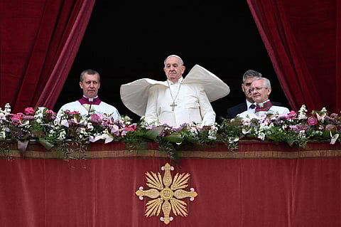 Pope Francis stands at the central loggia of St. Peter's Basilica for the Easter 'Urbi et Orbi' message and blessing to the City and the World as part of the Holy Week celebrations, in the Vatican on 31 March 2024.